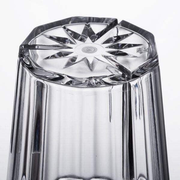 A close up of a Thunder Group clear polycarbonate tumbler with a diamond design.