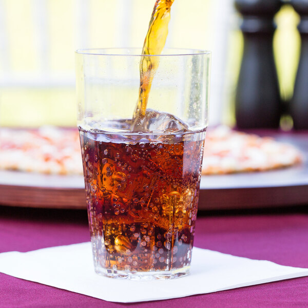 A Thunder Group clear plastic tumbler filled with soda.