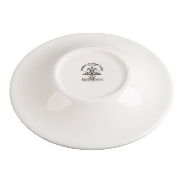 A white saucer shown upside down, displaying a manufacturer's mark on the bottom center.