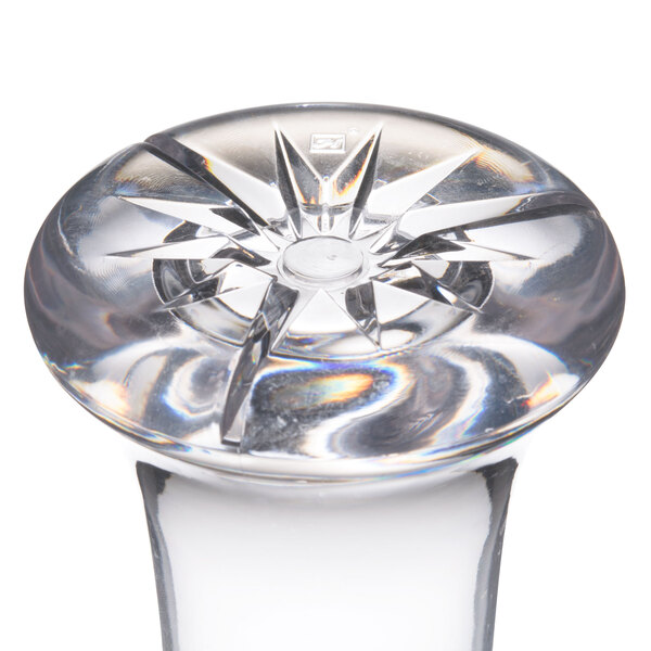 A clear plastic Thunder Group Pilsner glass with star shapes.