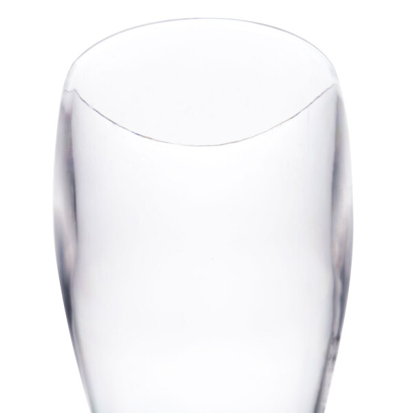 A close-up of a clear plastic Thunder Group Pilsner glass.
