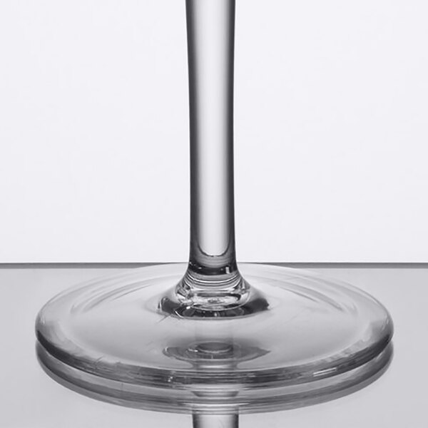 A close up of a Thunder Group plastic margarita glass with a thin stem.