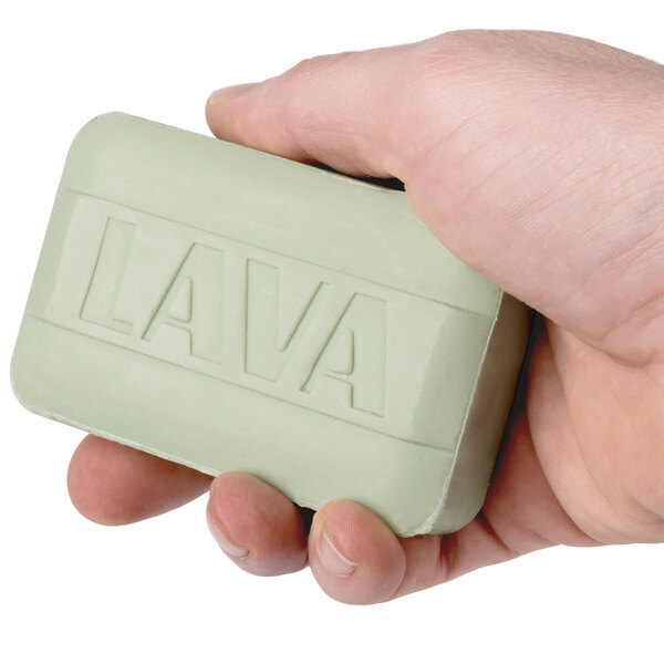 A person holding a Lava bar of soap