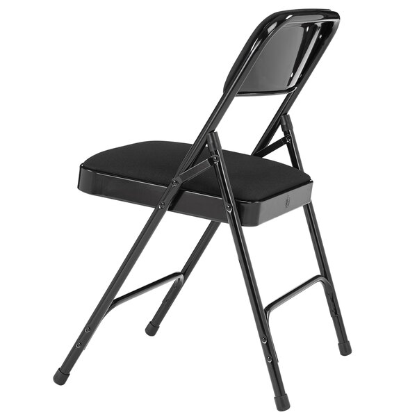 A National Public Seating black metal folding chair with a black fabric cushion.