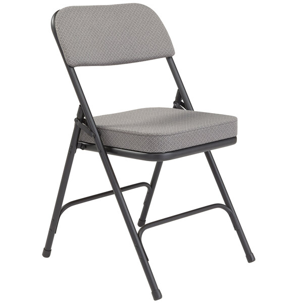 A National Public Seating black metal folding chair with a charcoal gray padded seat.