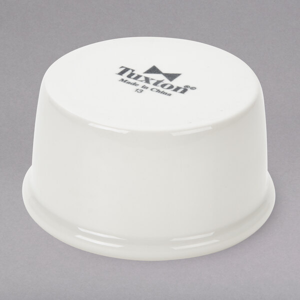 A white Tuxton china ramekin.