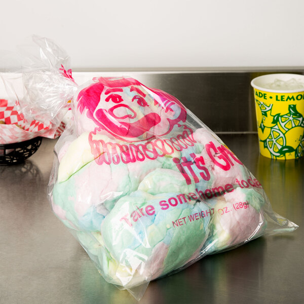 A yellow plastic bag with a cotton candy design on it.