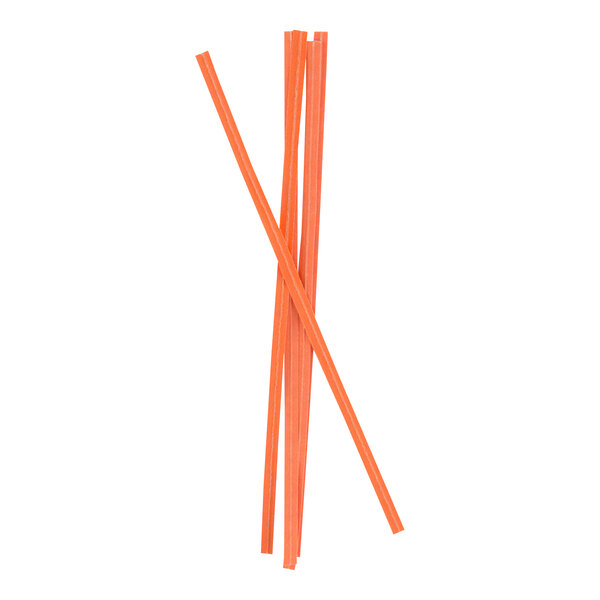 Several orange, flat, stick-like objects are arranged in a crisscross pattern against a white background.