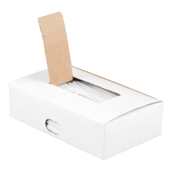 A white rectangular box with a partially opened cardboard flap, revealing white ties inside.
