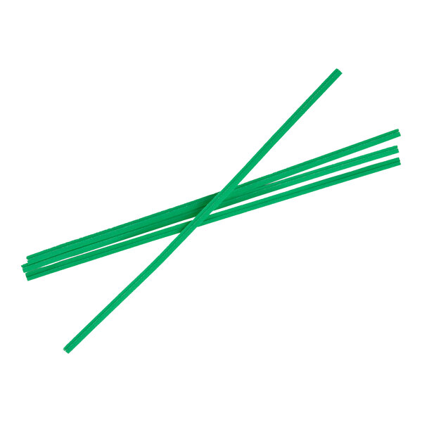 Five green, flat, stick-like objects are arranged in a crisscross pattern on a white background.