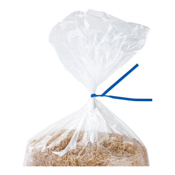 A clear plastic bag filled with rice is sealed at the top with a blue twist tie.