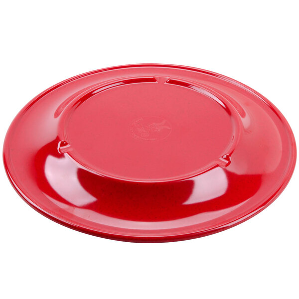 A red melamine plate with a wide rim.