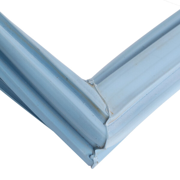 A close up of a Delfield magnetic door gasket corner with a metal frame.