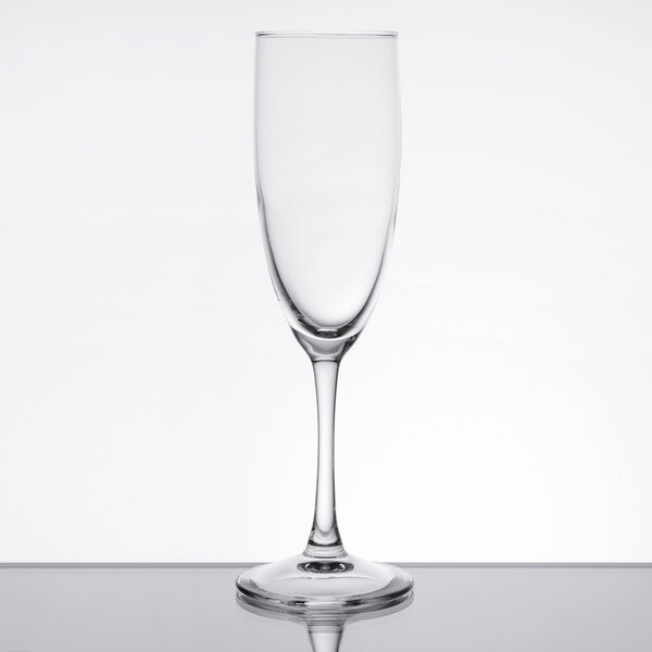 An Arcoroc Rutherford champagne flute with a stem on a white background.
