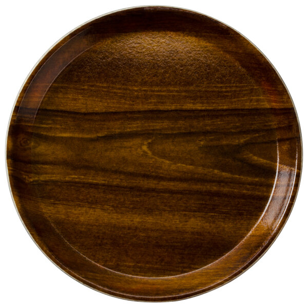 A round Cambro fiberglass tray with a Burma Teak wood grain finish.