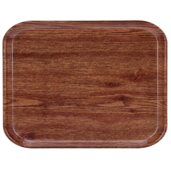 A rectangular Cambro Country Oak fiberglass tray with a wood finish.