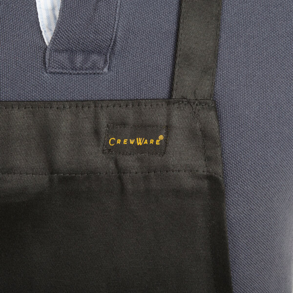 a black apron with yellow text