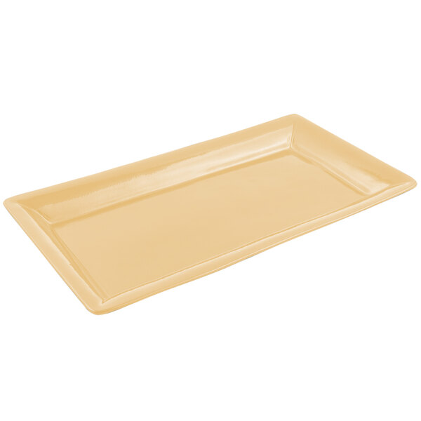 A rectangular tan Bon Chef display pan with a sandstone finish.