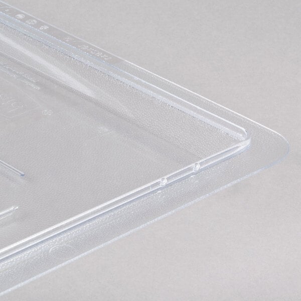 A clear Rubbermaid polycarbonate food storage box lid on a clear plastic container.