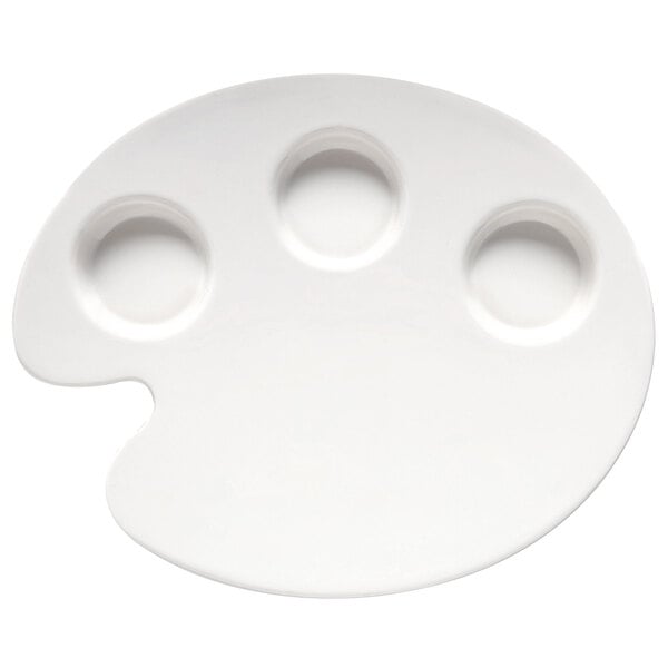 A white melamine plate with a circular center and three round holes around it.