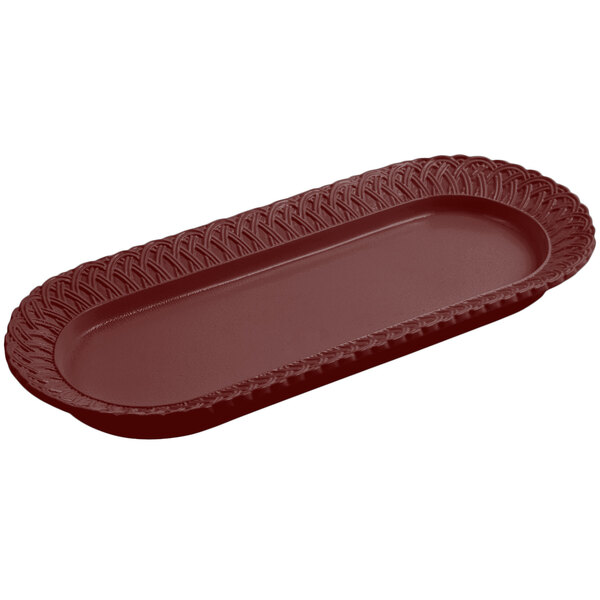 A rectangular Bon Chef cast aluminum fish platter with a terra cotta finish and trellis design.