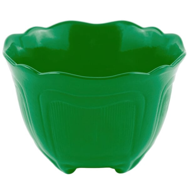 A green bowl with a scalloped edge.