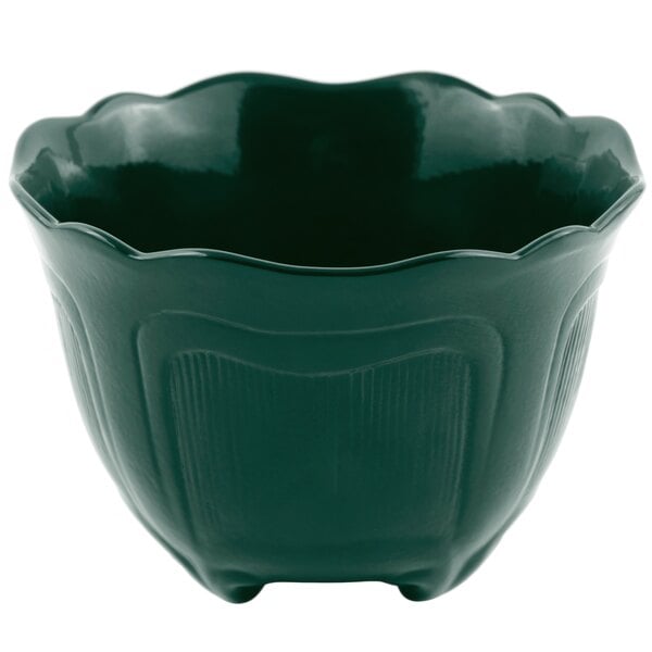 A Bon Chef hunter green cast aluminum bowl with a scalloped edge.