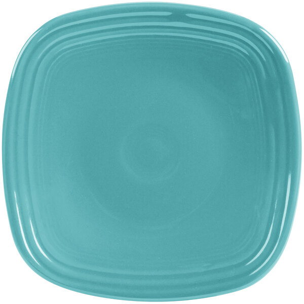 A blue square Fiesta® china salad plate with a white center.