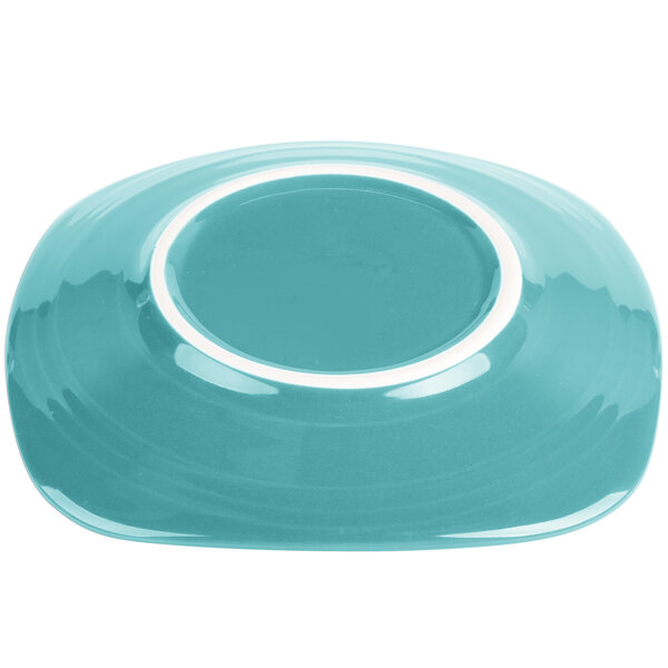 A turquoise Fiesta salad plate with a white rim.