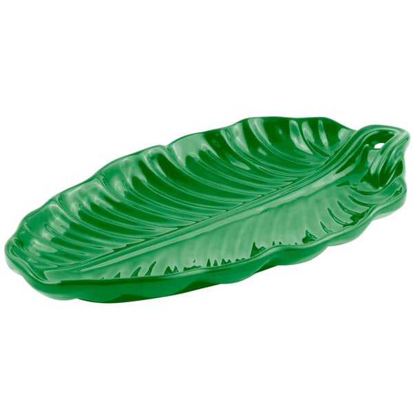 A green Bon Chef cast aluminum leaf platter on a counter.