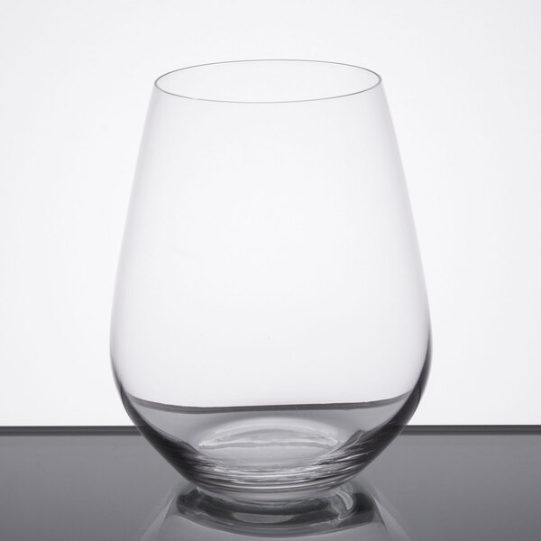 A Spiegelau Authentis stemless red wine glass filled with water on a table.