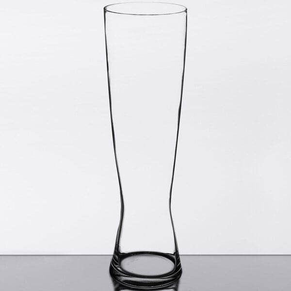 A Spiegelau tall Pilsner glass on a table.