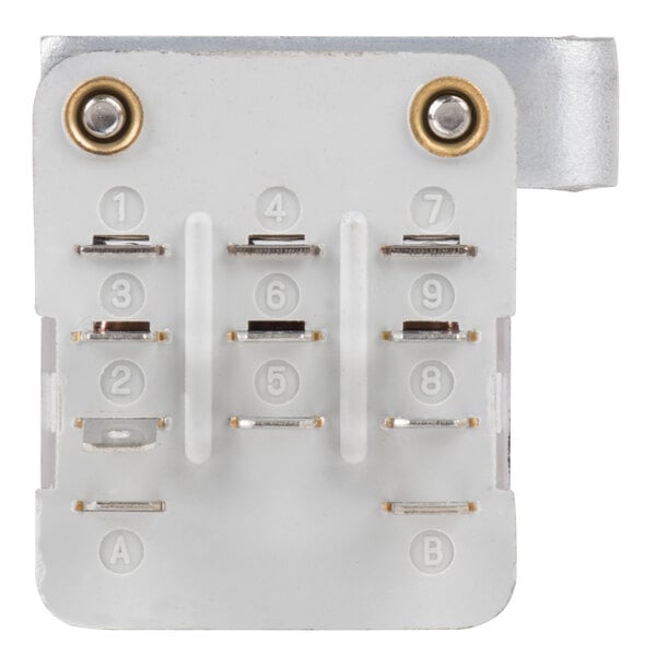 A white rectangular object with metal screws and rivets.