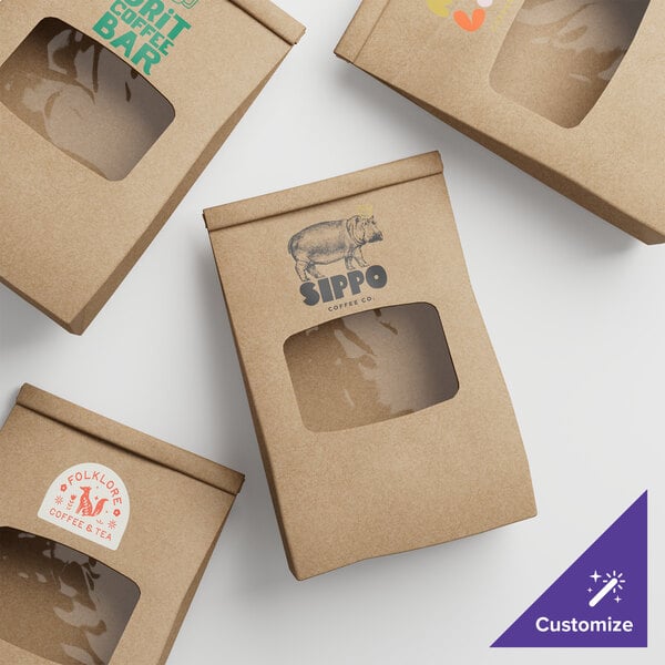 A group of brown paper bags with a clear window.