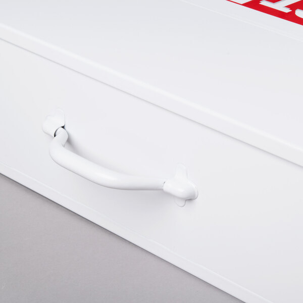 A white Medique first aid kit cabinet with a red handle.