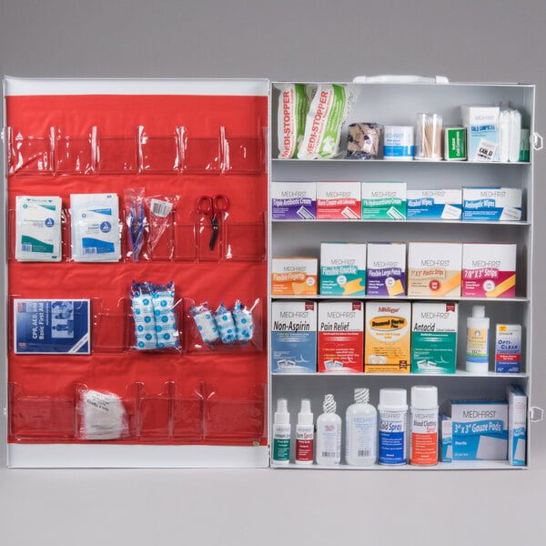 A mounted, open first aid kit