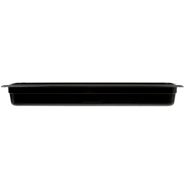 A black Rubbermaid plastic food pan on a counter.