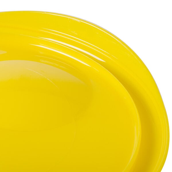 A yellow Rubbermaid food storage container lid.