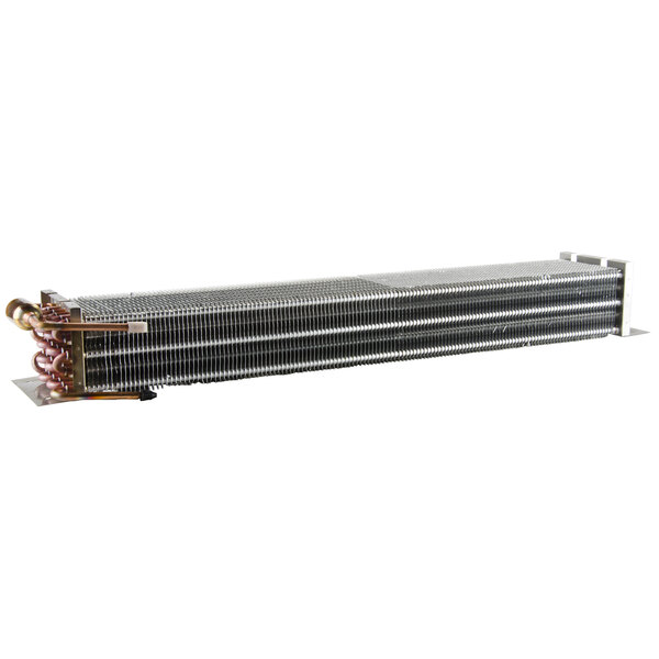 A close-up of a metal heat exchanger with a copper coil.