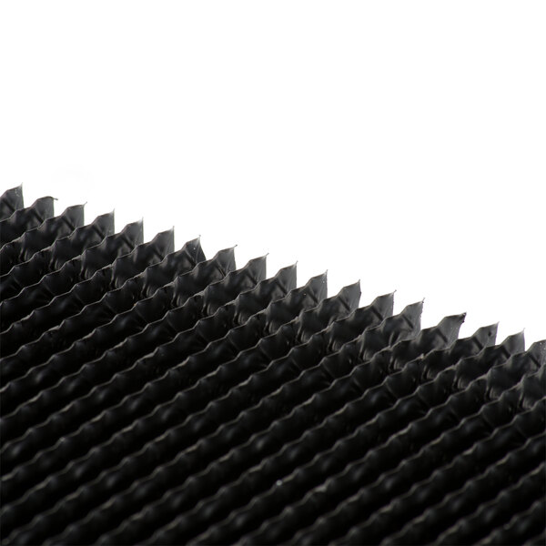 A close-up of a black grid on a black surface.