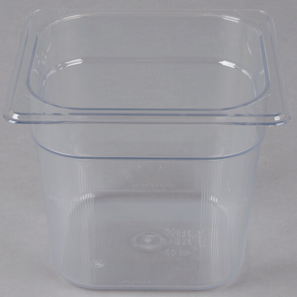 A Rubbermaid clear plastic food pan with a lid.