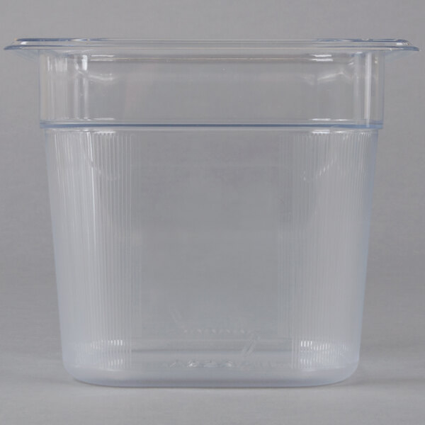 A Rubbermaid clear plastic food pan with a lid on it.