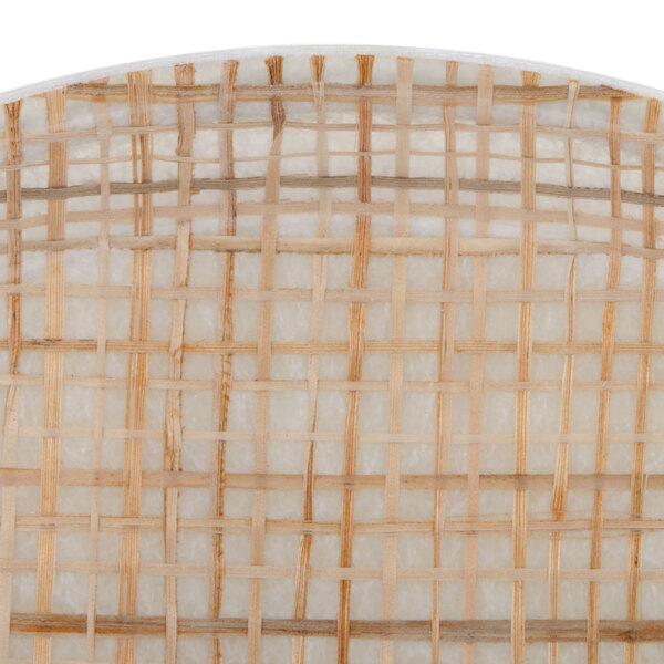 A close up of a white and brown woven Cambro round tray with a white rim.