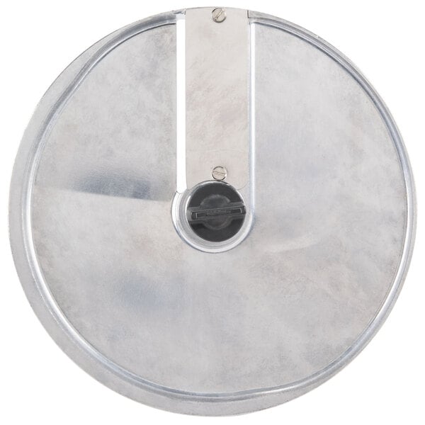 A circular metal object with a black handle.