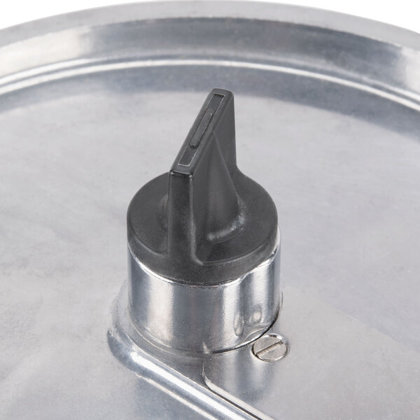A close-up of a Robot Coupe stainless steel slicing disc with a black and silver knob.