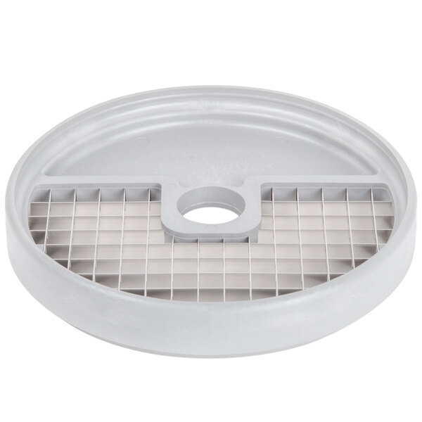 A white plastic lid with a grid on top.