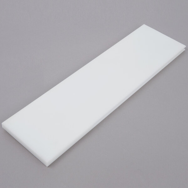 A white rectangular board conversion kit for Nemco Easy Tomato Slicers on a gray surface.