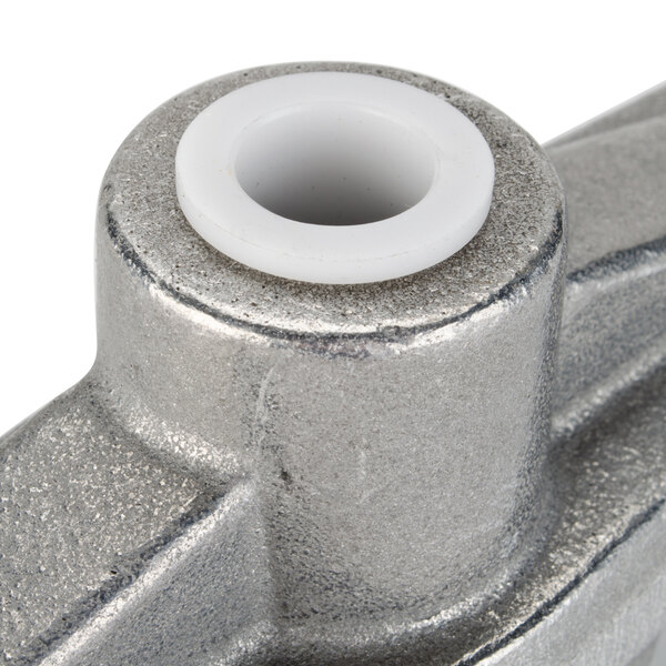 A close-up of a metal Nemco top beam assembly with a white plastic circle.