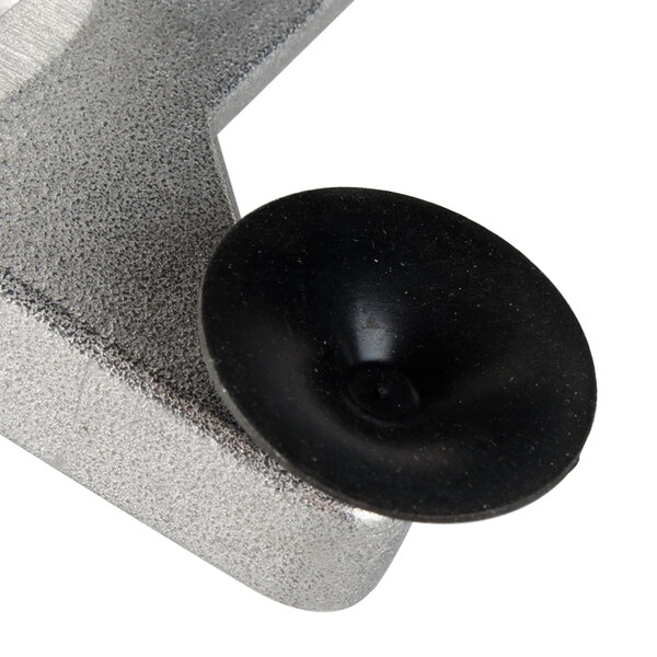 A metal hanger assembly with a black button on it.