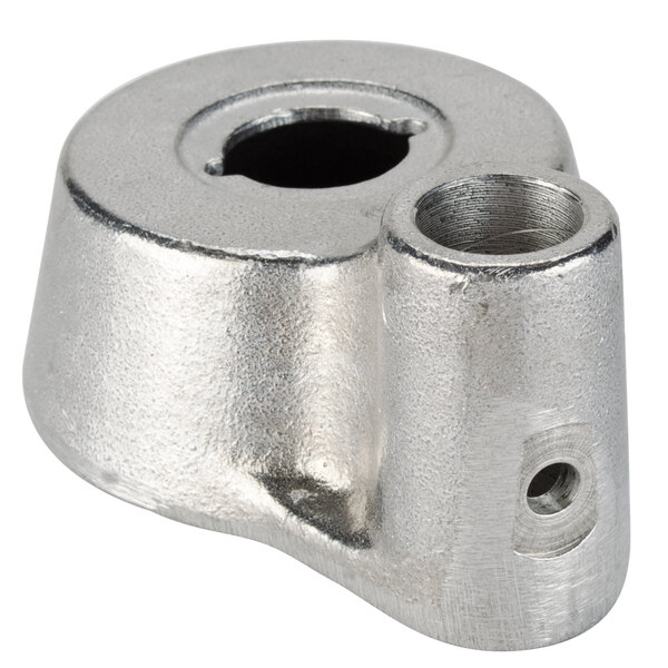 A silver metal support with holes.